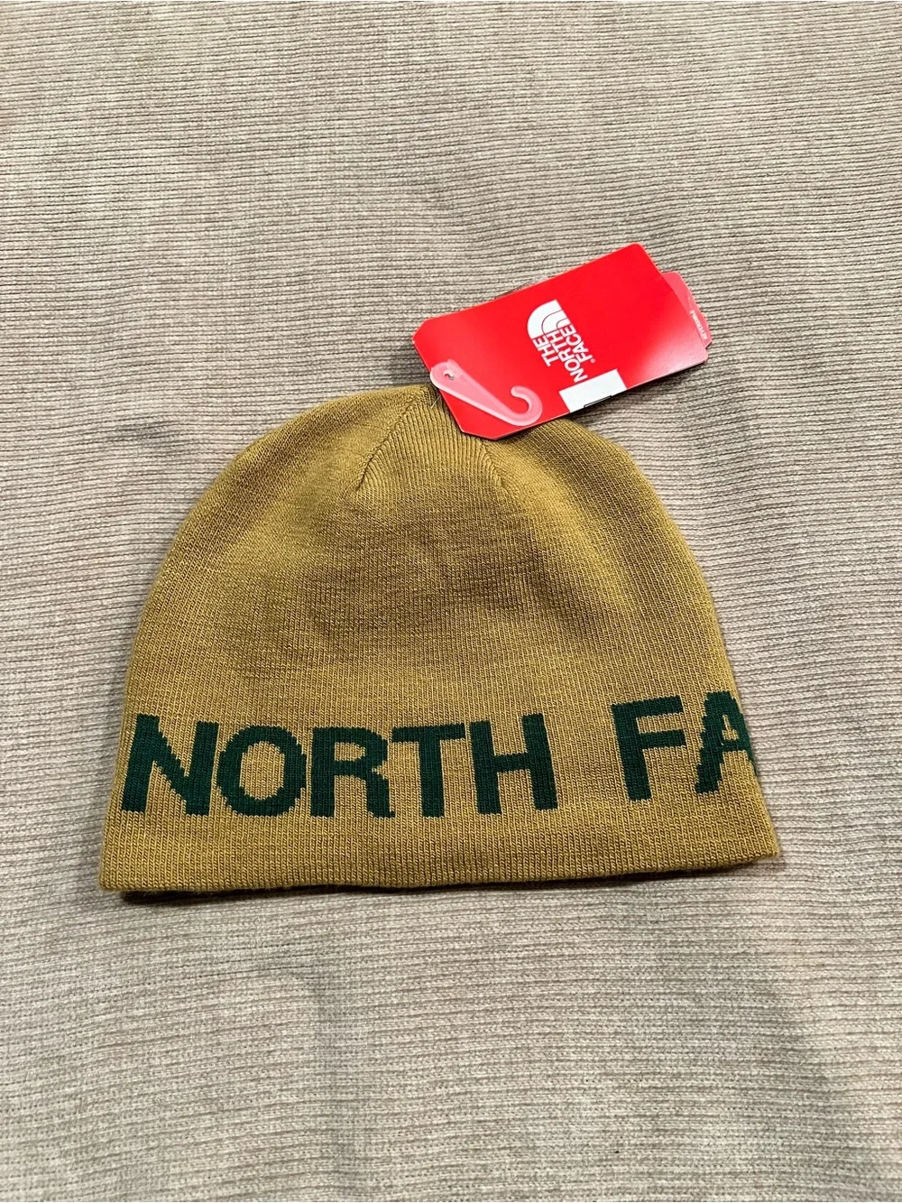 The North Face Mustard Yellow Beanie with Dark Green Lettering